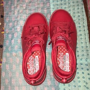 All red sketchers sneakers
